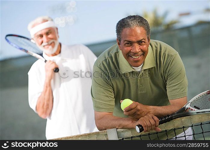 Two male tennis players on court