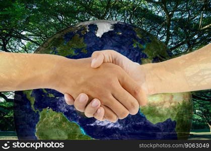 two man are hand shaking on earth and tree background, Elements of this image furnished by NASA