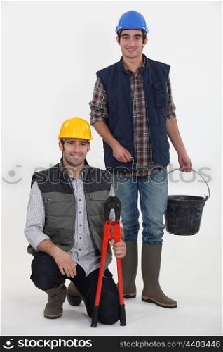 Two manual workers collaborating