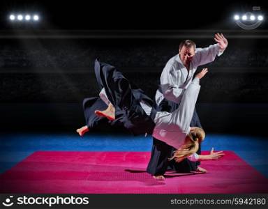 Two martial arts fighters at sports hall