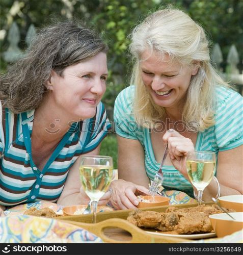 Two mature women having picnic