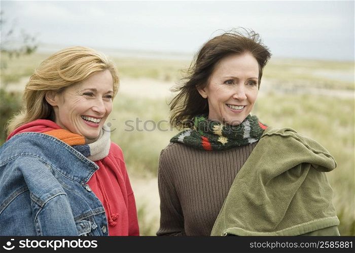 Two mature women smiling