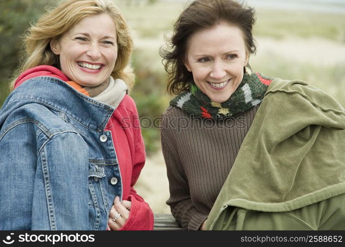 Two mature women smiling