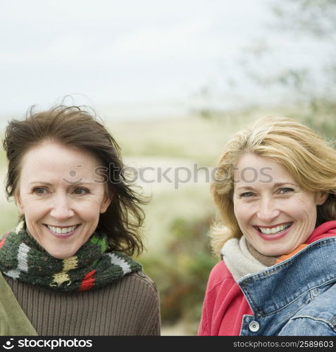 Two mature women smiling