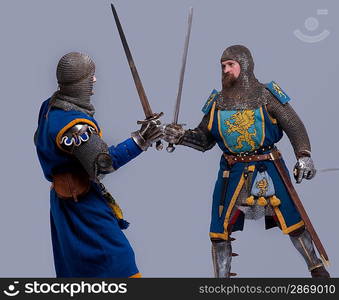 Two medieval knights fighting.