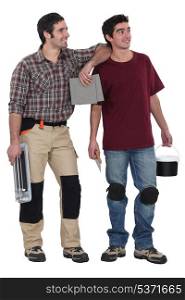 Two men about to plaster