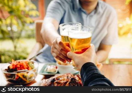 Two men are drinking alcohol in a restaurant.