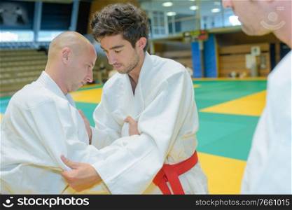 Two men competing at judo