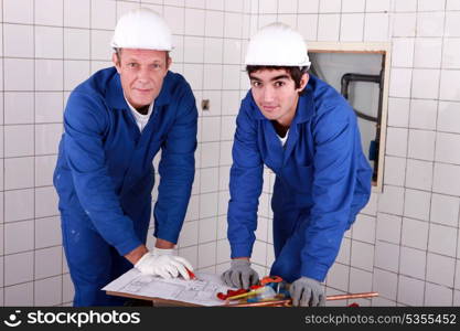 Two men do DIY