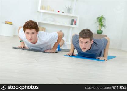 Two men doing push-ups
