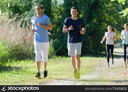 two men friends jogging outdoors