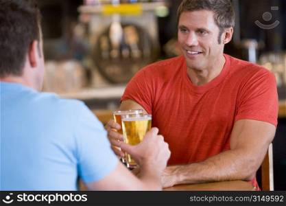 Two men having beer together