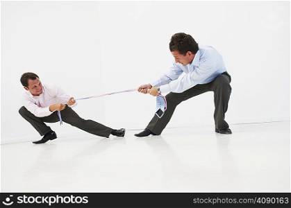 Two men having tug-o-war