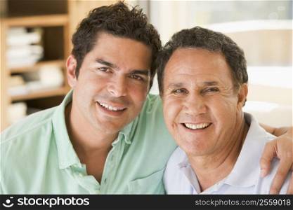 Two men in living room smiling