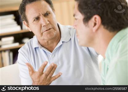 Two men in living room talking