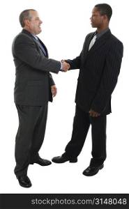 Two men in suits shaking hands.