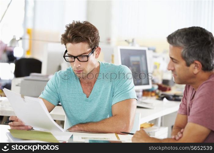 Two Men Meeting In Creative Office
