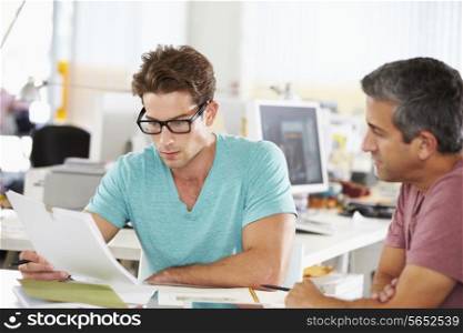 Two Men Meeting In Creative Office