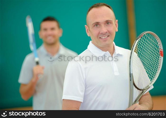 Two men on tennis court