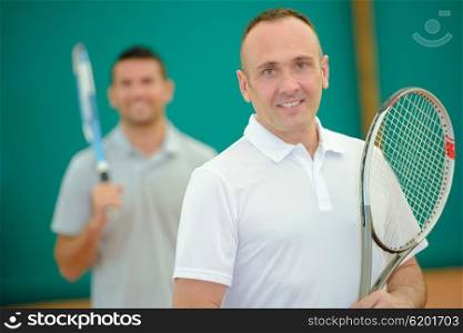 Two men on tennis court
