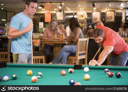 Two men playing pool