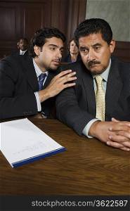 Two men sitting in court