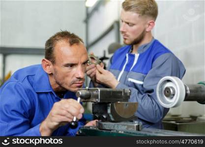 two men working in engineering workshop