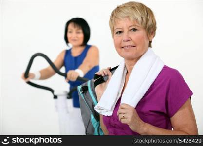 Two middle-aged women at the gym