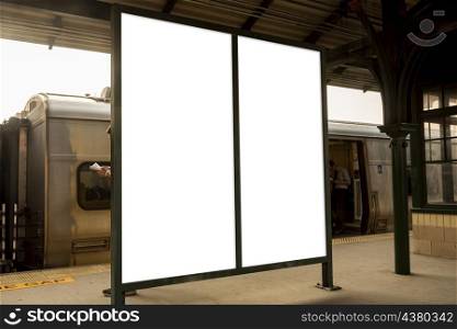 two mock up billboards train station