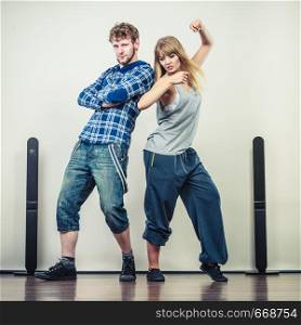 Two modern dancers couple woman and man dancing. Urban lifestyle. Hip-hop generation.