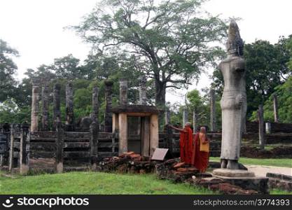 Two monks near Latha-Mandapaya temple in Polonnaruwa, Sri Lanka