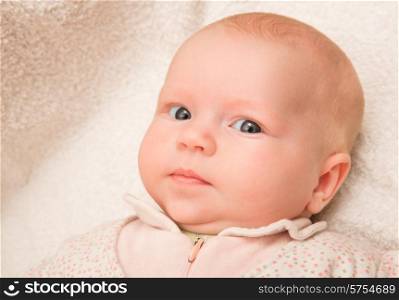 Two-month old baby girl on a light background