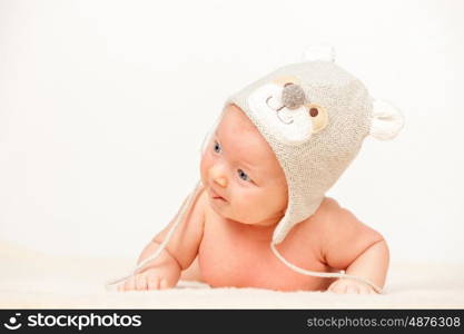 Two months old newborn baby in funny hat