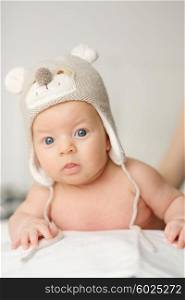 Two months old newborn baby in funny hat
