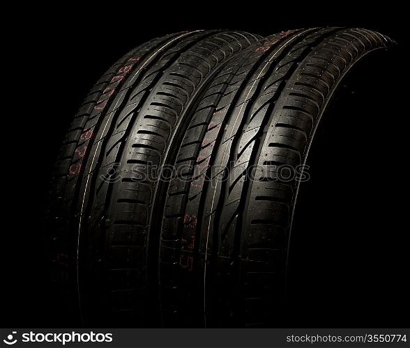 Two new car tires close up