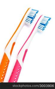 two new toothbrushes on a white background