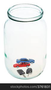 two new vehicles with keys in open glass jar