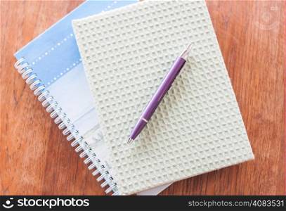 Two of notebooks and pen, stock photo