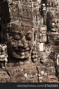 Two of the 138 faces that are carbed into the towers of the Bayon temple in Angkor Thom in Cambodia.&#xA;