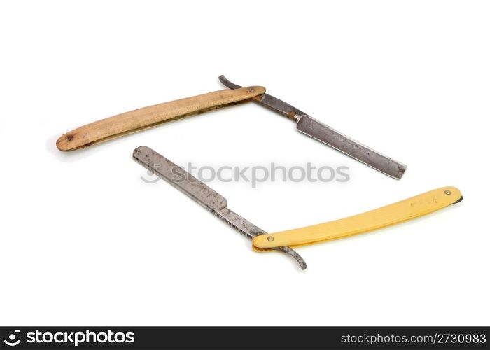 Two old rusty razors on white background