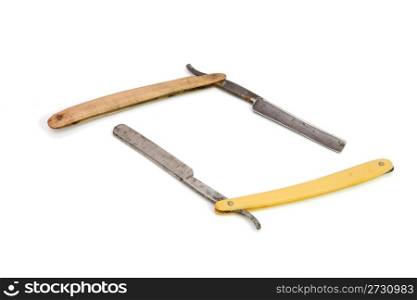 Two old rusty razors on white background