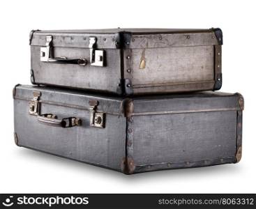 Two old suitcases stacked isolated on white background. Two old suitcases stacked