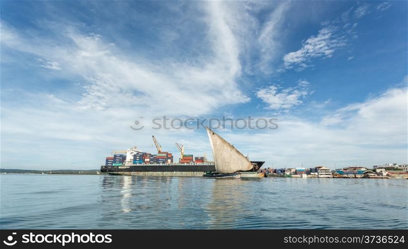 Two old wooden boats floating on the shores of Zanzibar, Tanzania