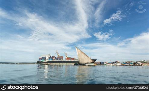 Two old wooden boats floating on the shores of Zanzibar, Tanzania