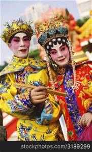 Two opera performers smiling, Hong Kong, China