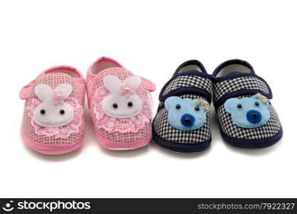 Two pairs of baby shoes, pink and blue. Isolate on white.