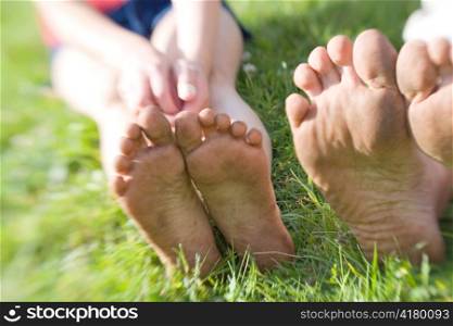 Two Pairs of Dirty Bare Feet