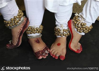 Two pairs of legs in Kathak pose