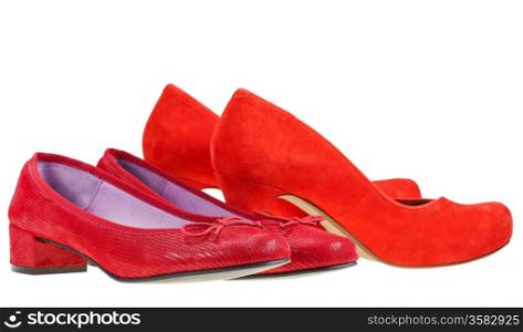 Two pairs of red woman pumps shoes isolated on white background