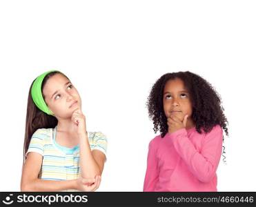 Two pensive little girl isolated on a white background